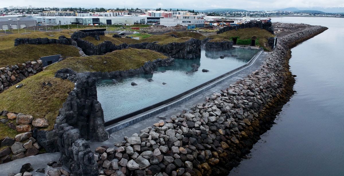 Aerial view of Sky Lagoon geothermal pool beside the ocean at Kópavogur, Reykjavik, Iceland