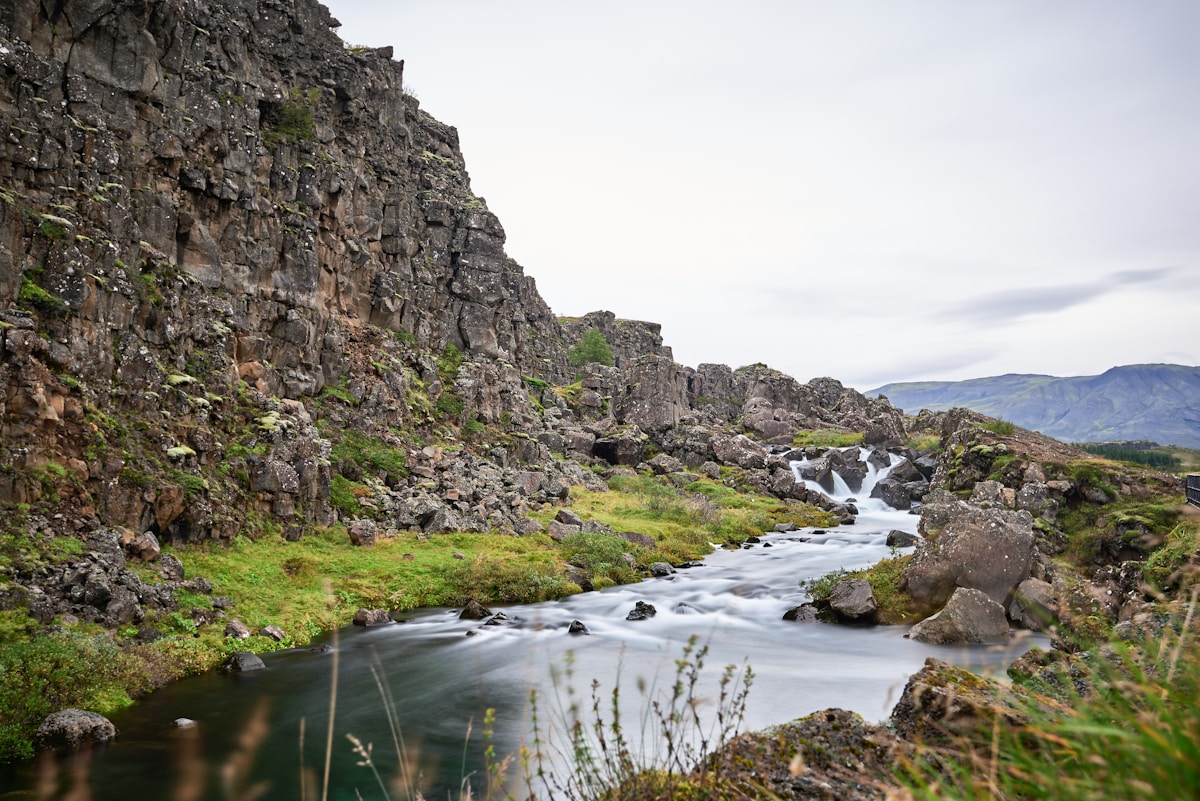 River flowing through rocky tectonic rift valley at Þingvellir National Park, Iceland