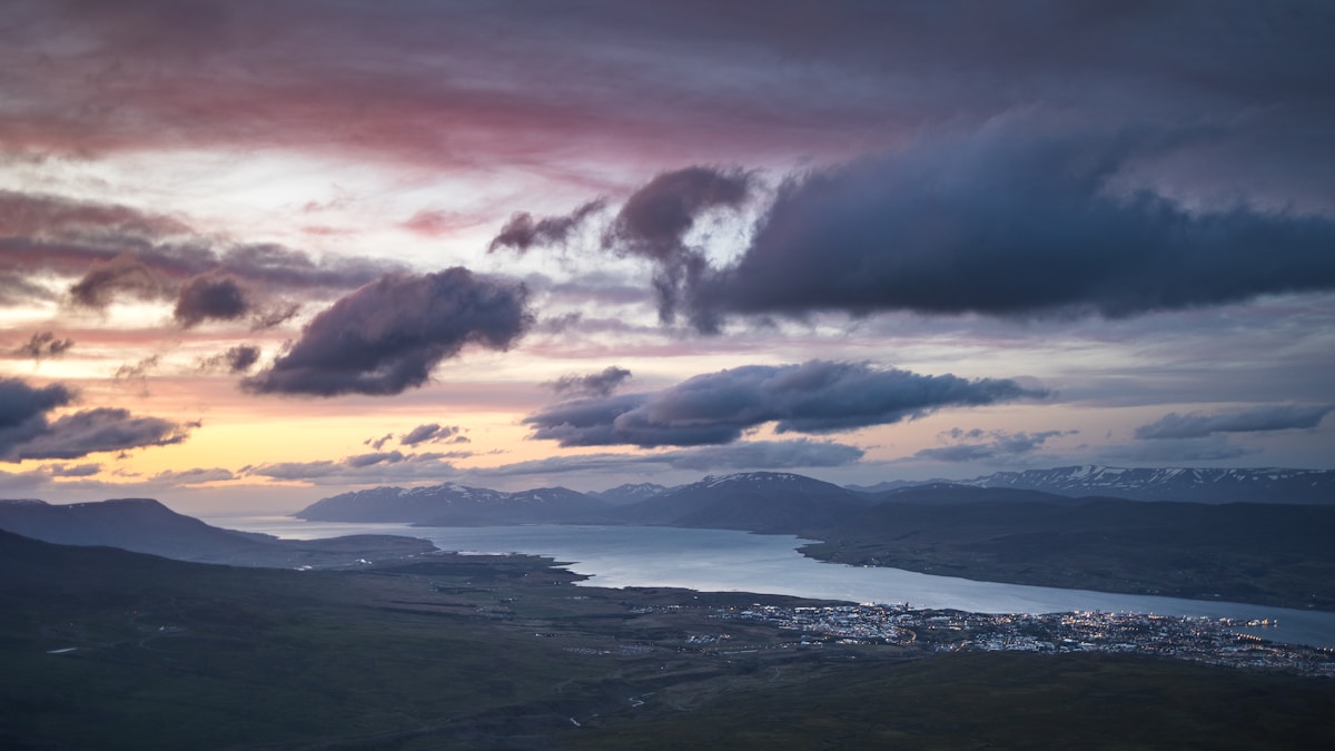 View of Akureyri city and Eyjafjörður fjord under a cloudy sky, north Iceland