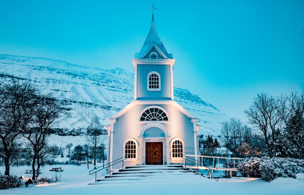 Blue Church and rainbow street in Seyðisfjörður, East Iceland