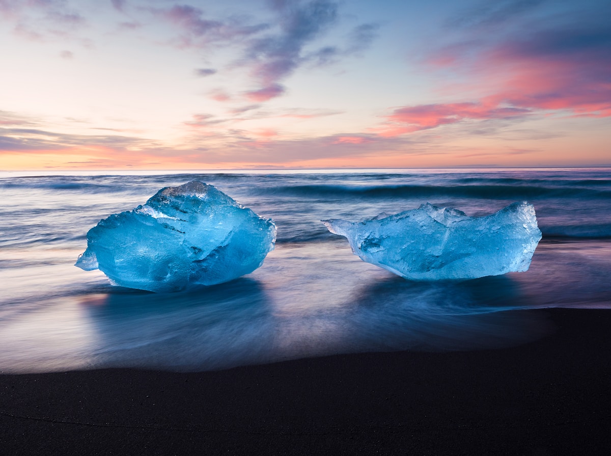 Two icebergs washed ashore on Diamond Beach near Jökulsárlón, Höfn, Iceland