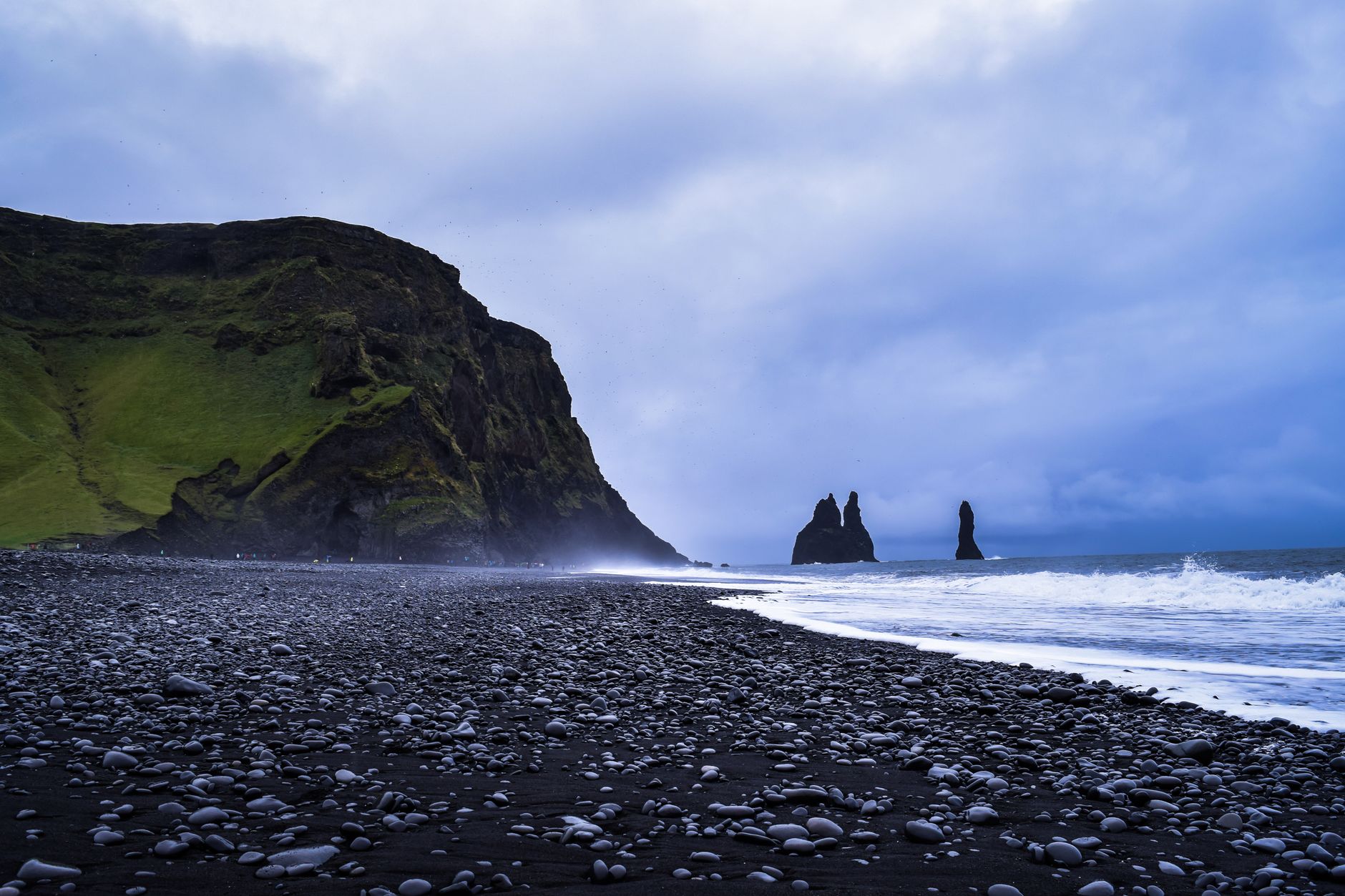 Reynisfjara black sand beach with Reynisdrangar basalt sea stacks and surf, Vík, south Iceland