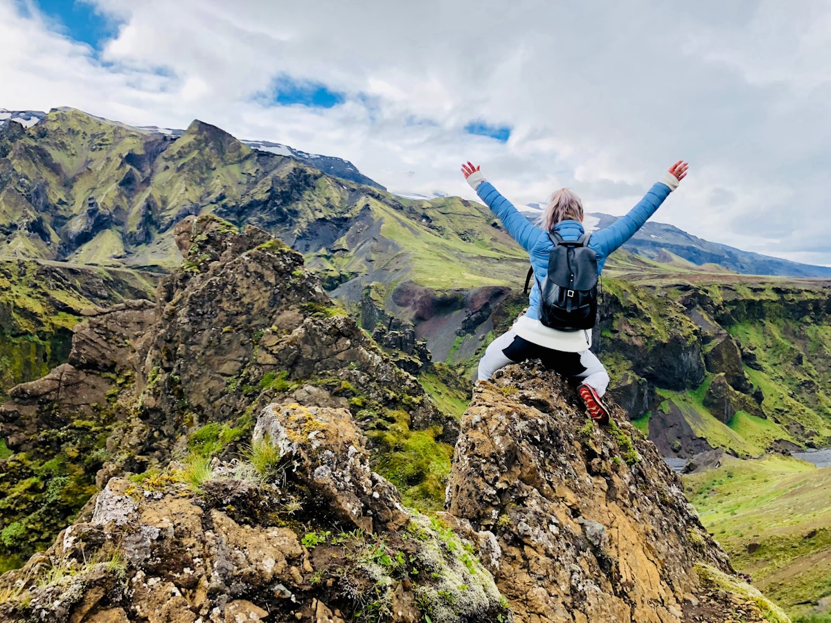 Hiking trail through the forested Þórsmörk valley between glaciers in Iceland