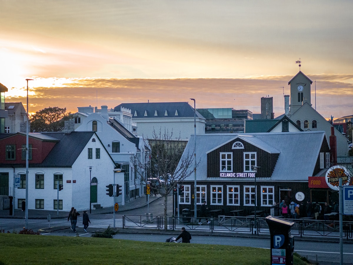 Reykjavik townscape with buildings and rooftops under a warm sunset sky, Iceland