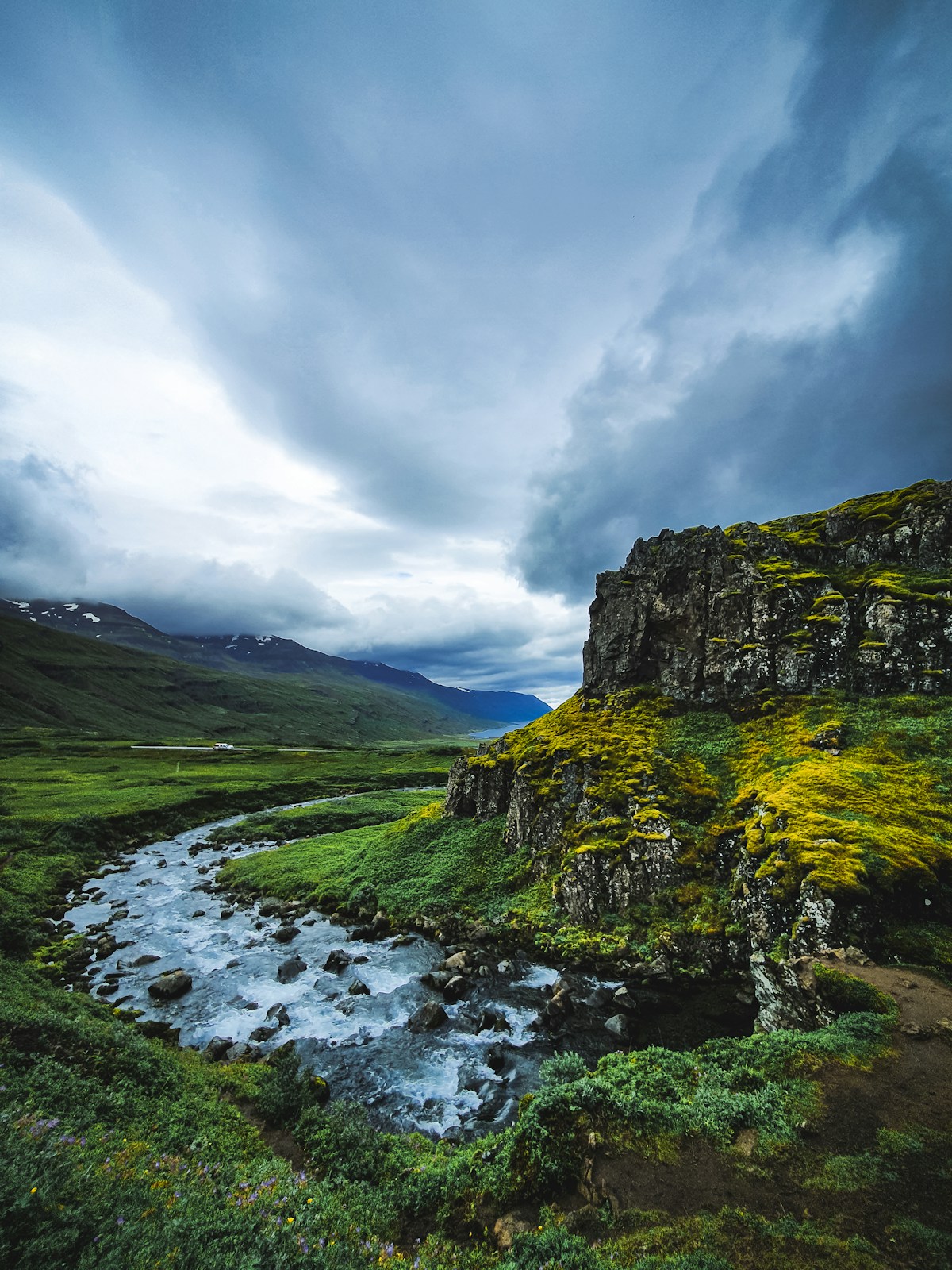River running through a narrow mountain valley in Mjóifjörður, east Iceland
