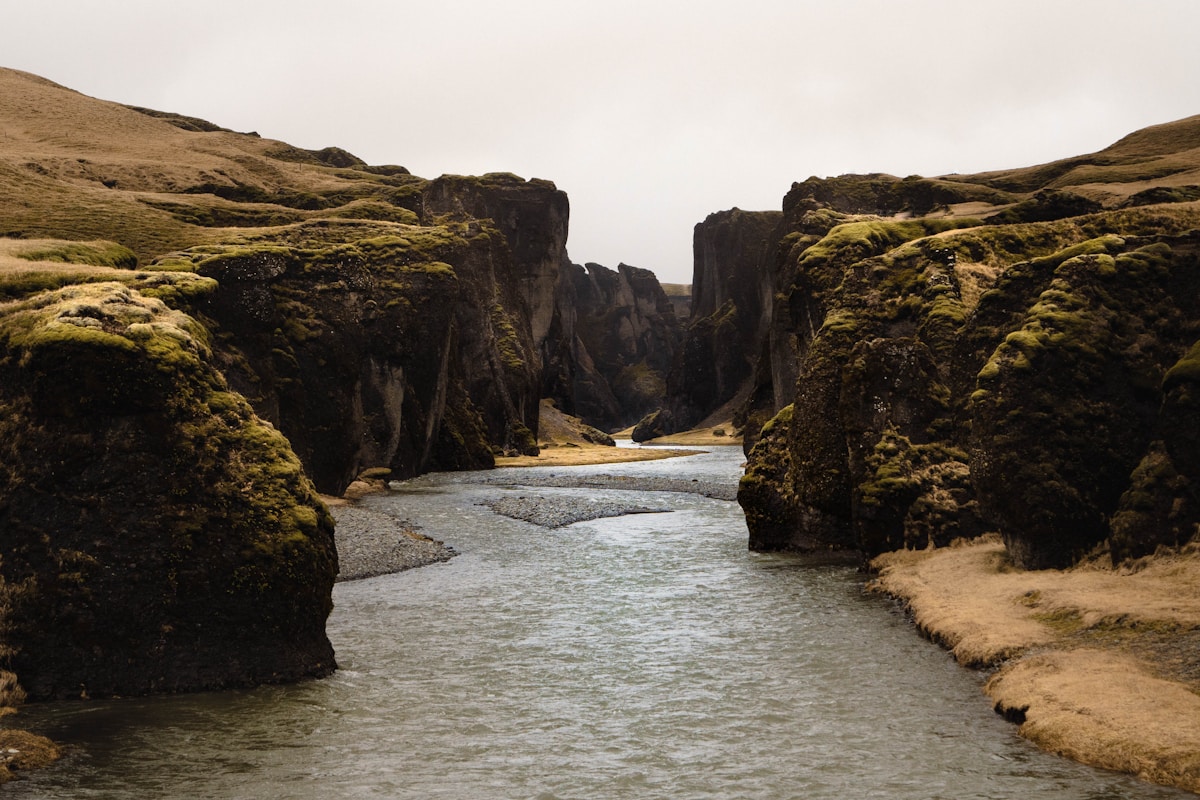 River running between rocky cliffs at Fjaðrárgljúfur canyon near Kirkjubæjarklaustur, south Iceland