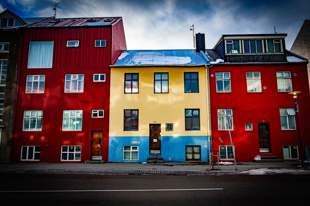 Row of colourful multi-coloured buildings on a street in Reykjavik, Iceland