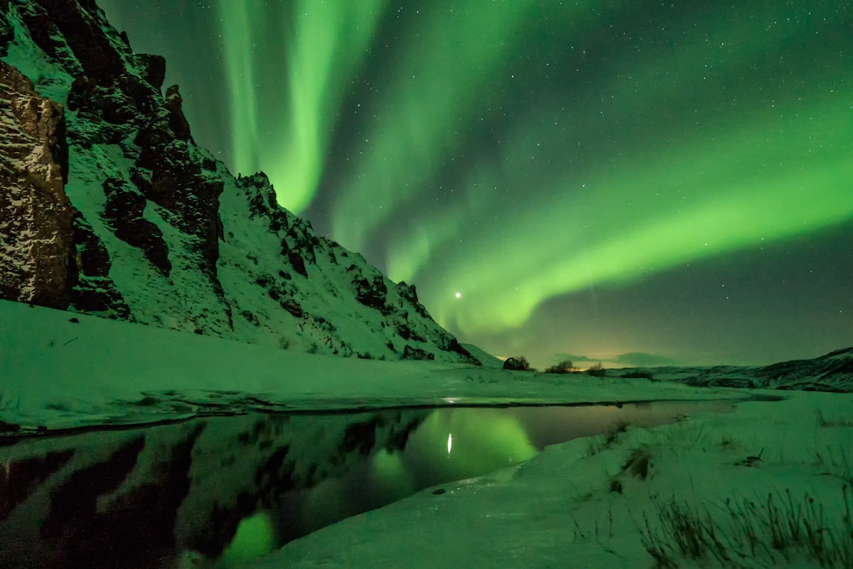 Snow-covered mountain with aurora borealis, Þórsmörk, Iceland — February