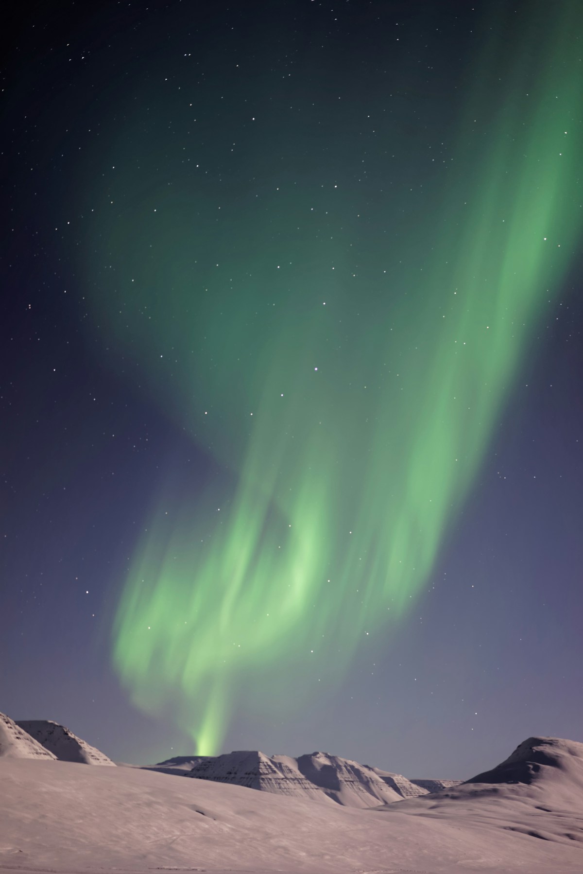 Aurora lights above mountain, north Iceland — October northern lights season