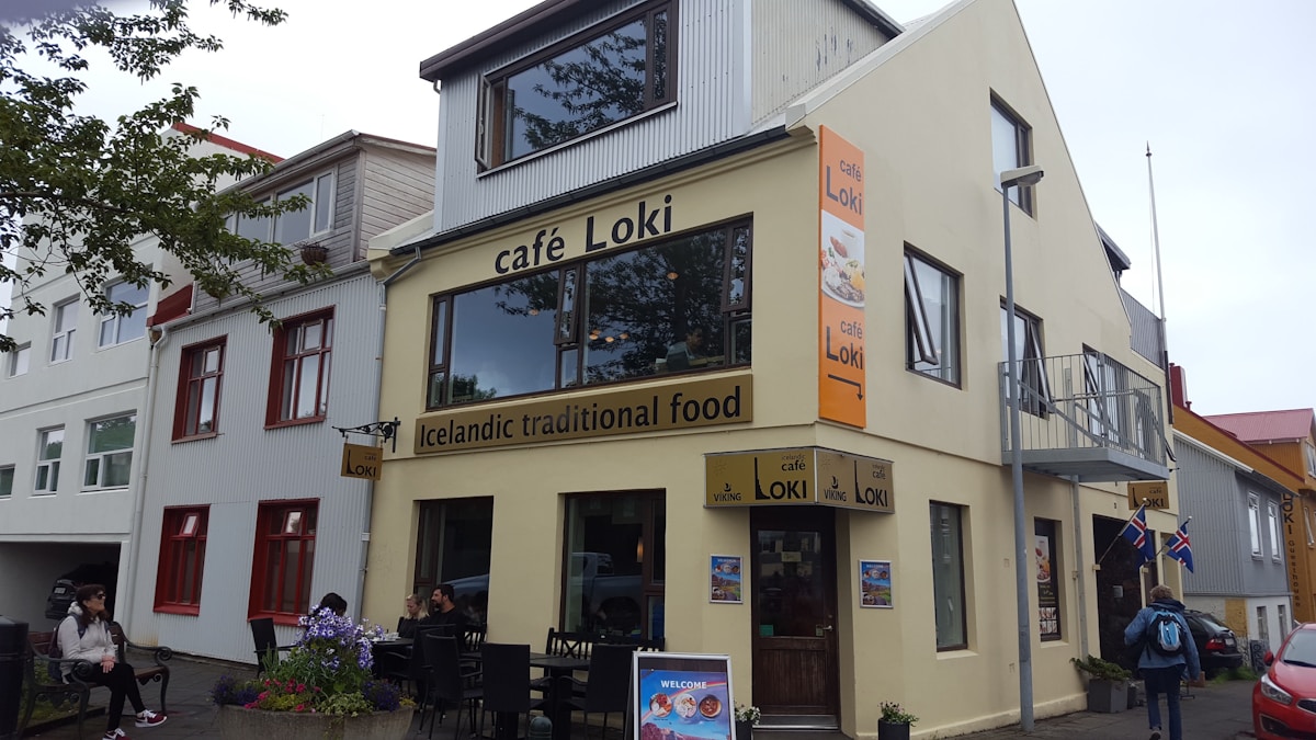 Yellow building with large windows on a street in Reykjavik, Iceland