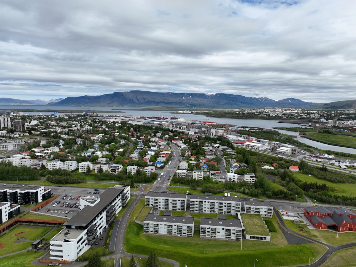 Aerial view of Reykjavík with mountains — airport transfers guide