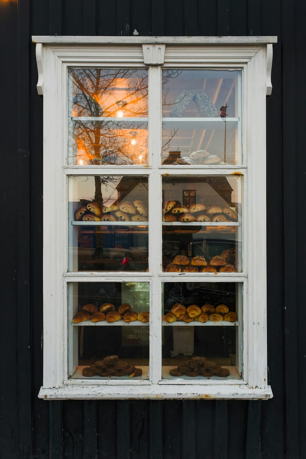 Window display of pastries and baked goods in a Reykjavik cafe, Iceland