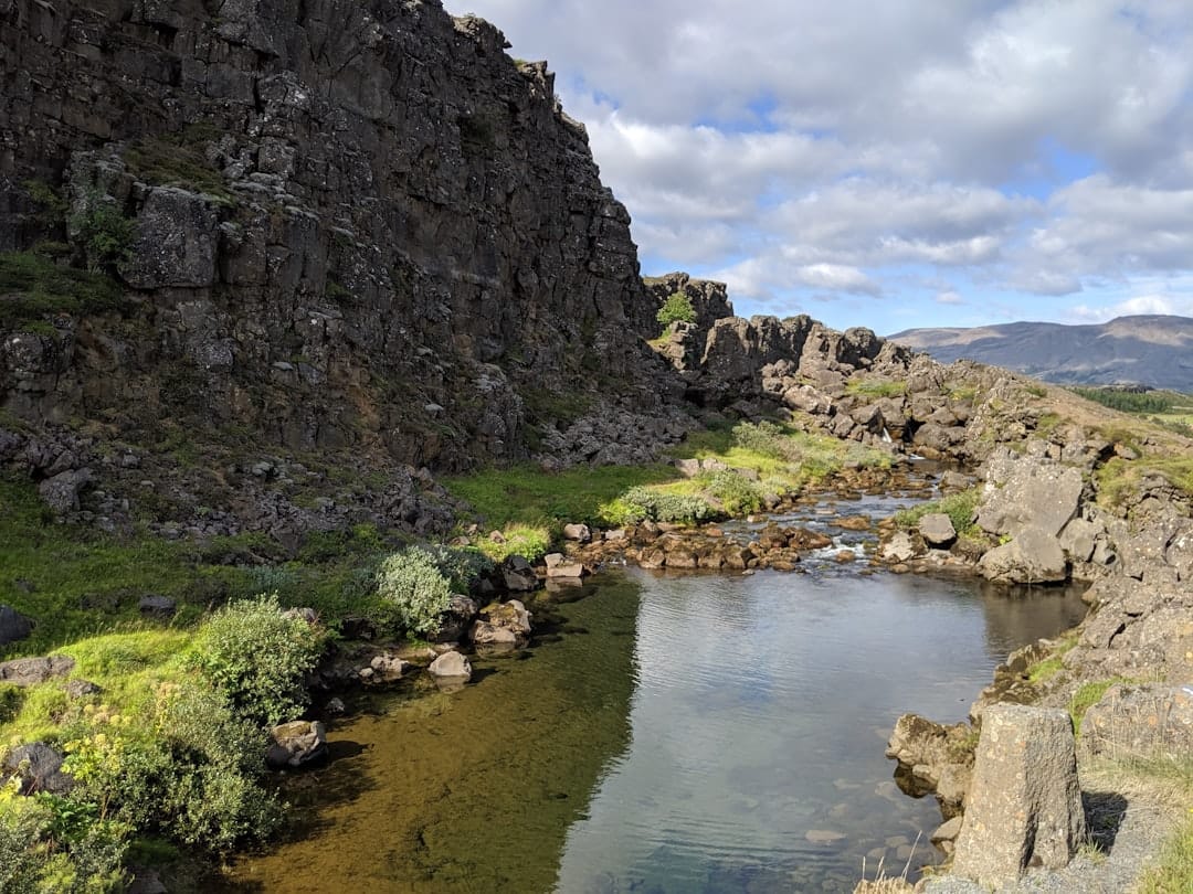 Crystal-clear river through basalt canyon at Þingvellir National Park near Selfoss