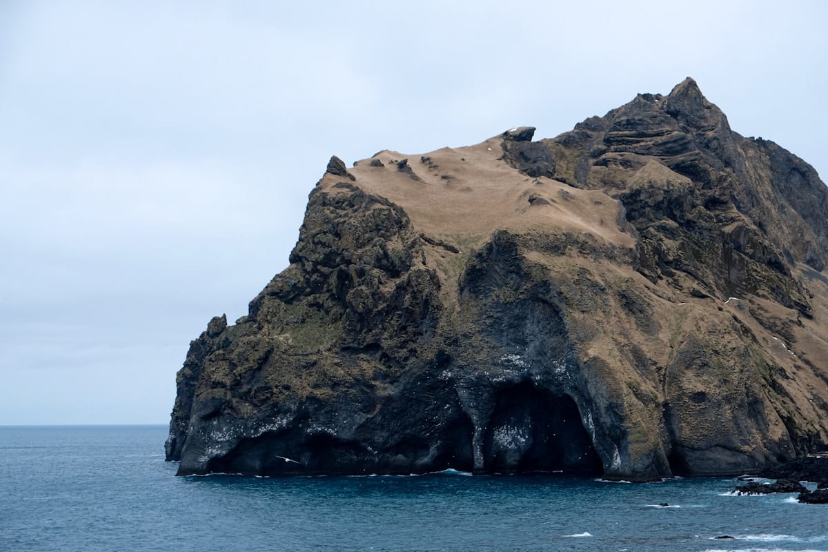 Volcanic rocky island with sea caves and the Atlantic Ocean, Vestmannaeyjar Iceland